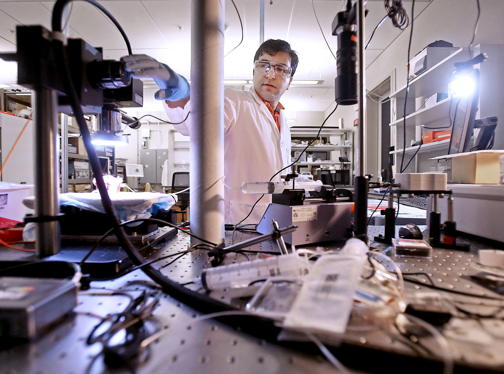 Samimi amid lab equipment